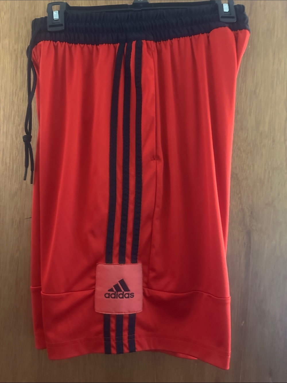 adidas Red Shorts with Black Three-Stripe Detail